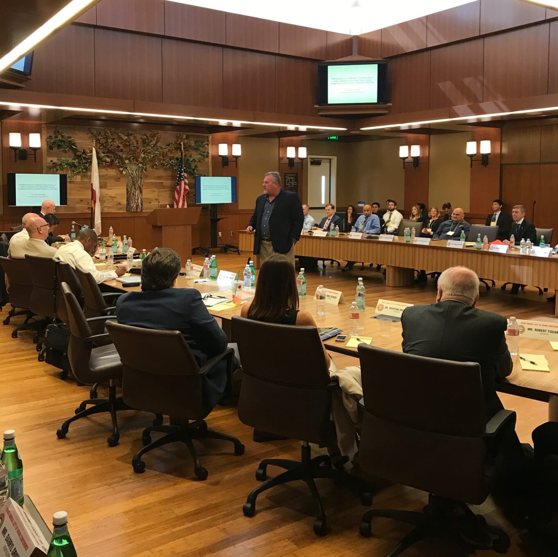 Greg Williams presenting in a corporate boardroom